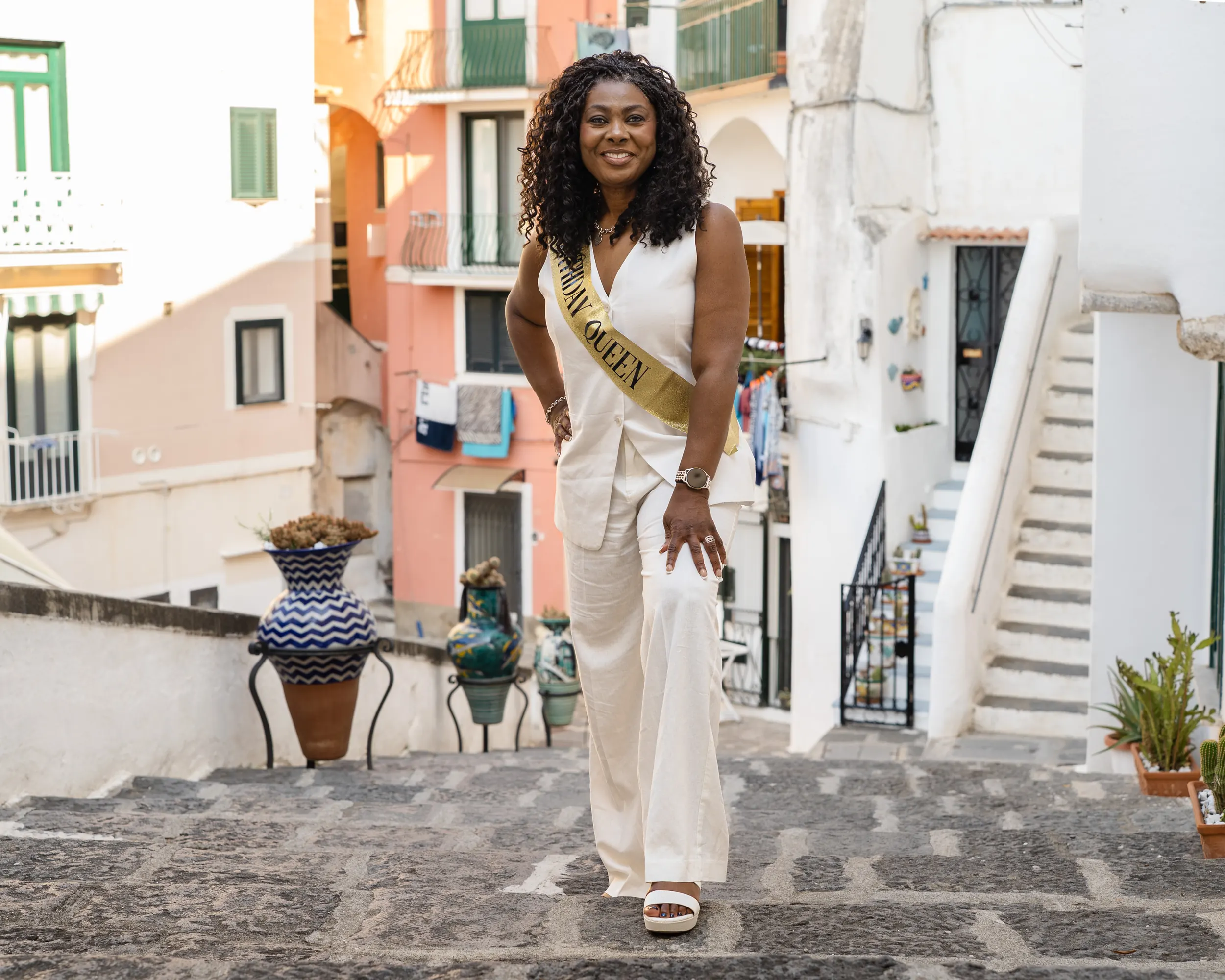 Golden crown and ribbon styling on the coast