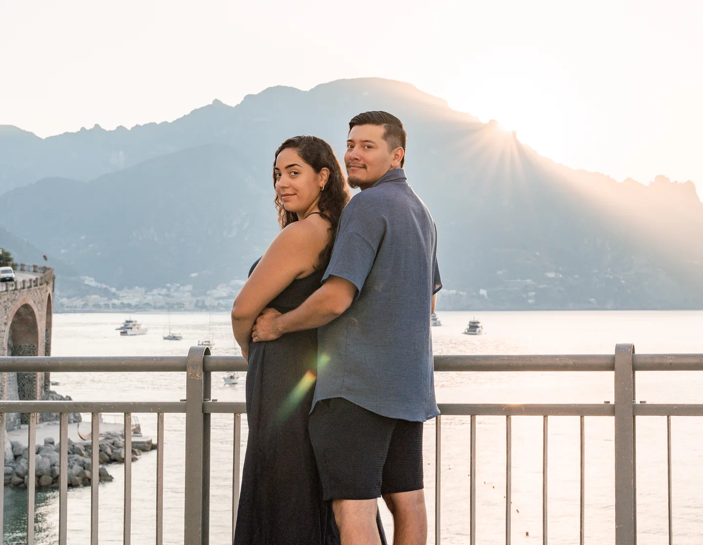 An embrace against the sunlit mountain backdrop