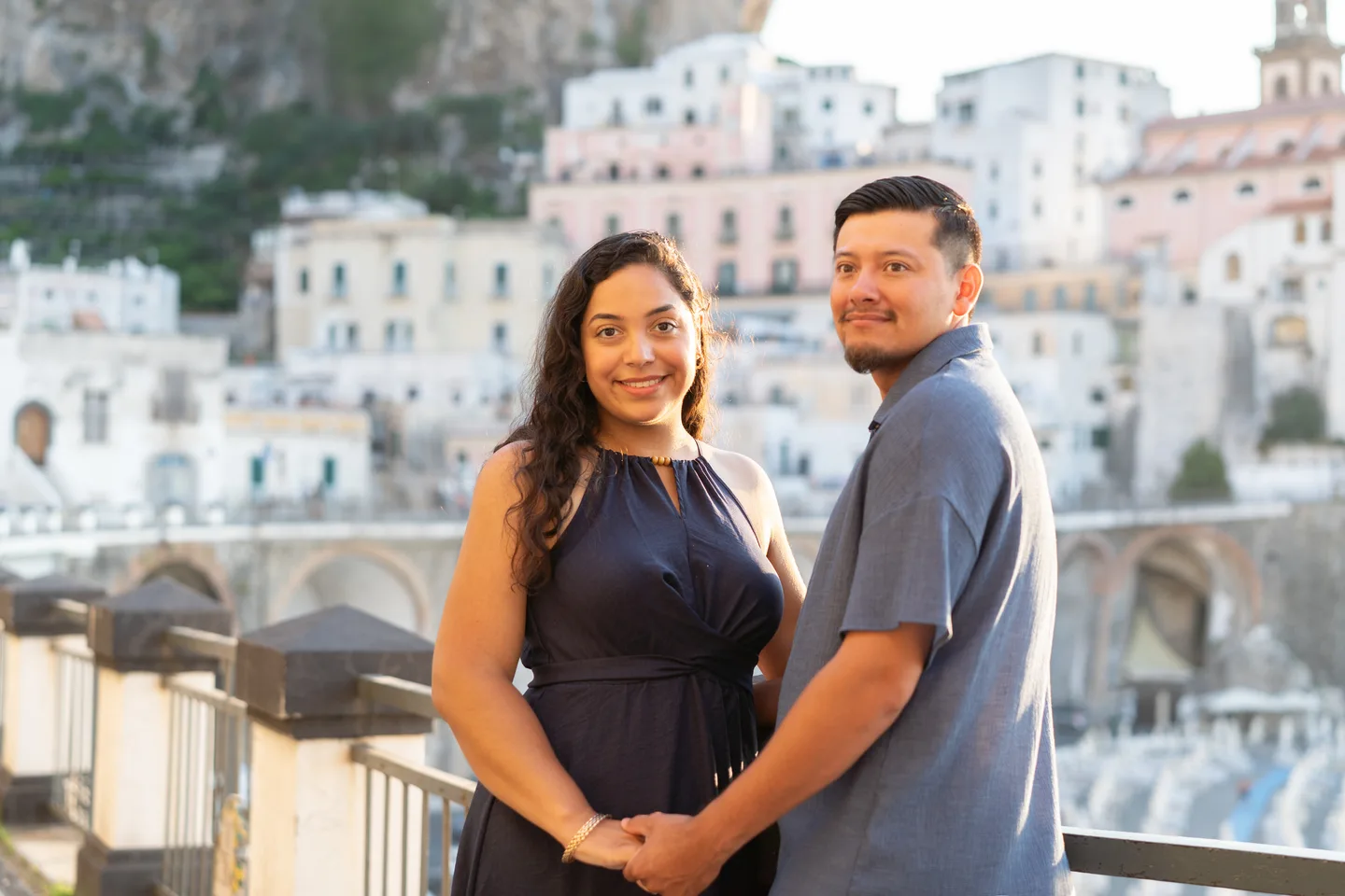 Esmeralda and her companion holding hands above the village square