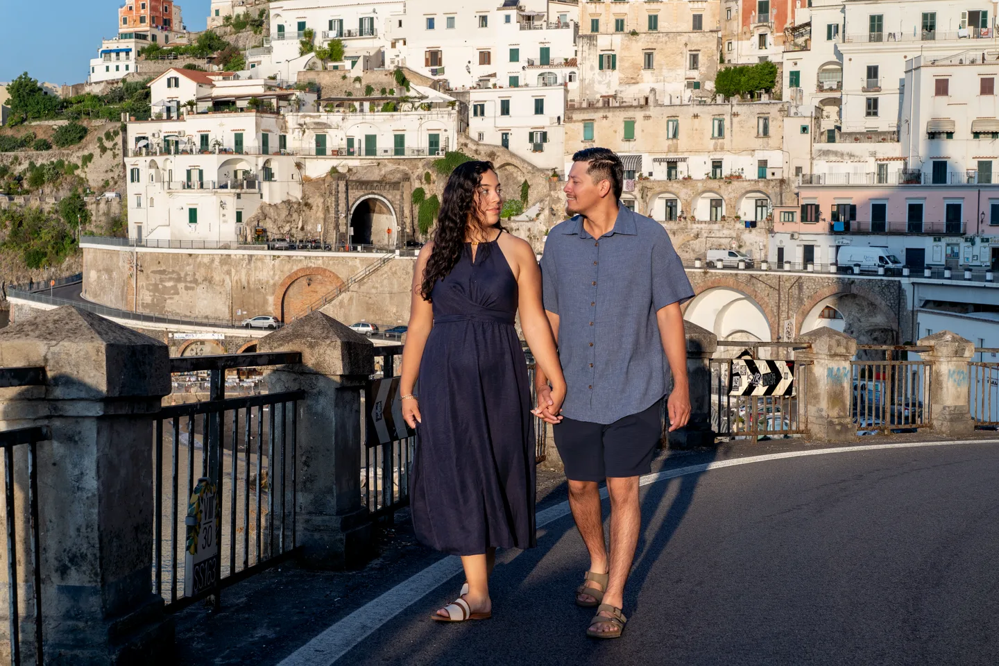 The couple walking past Atrani’s sunlit houses
