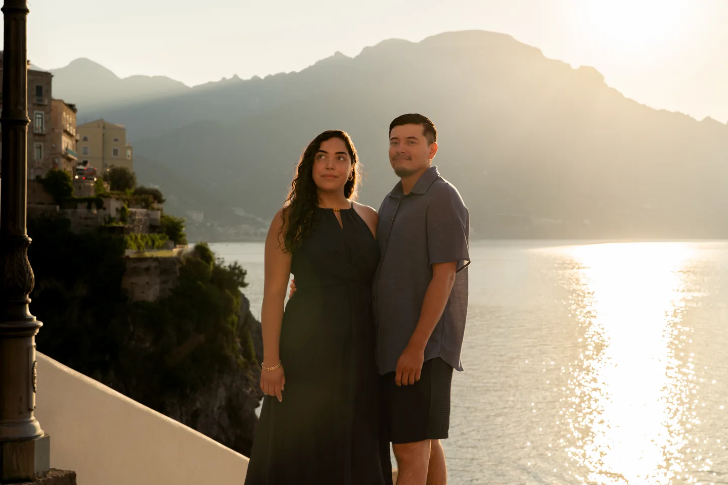 The couple standing above the shining sea