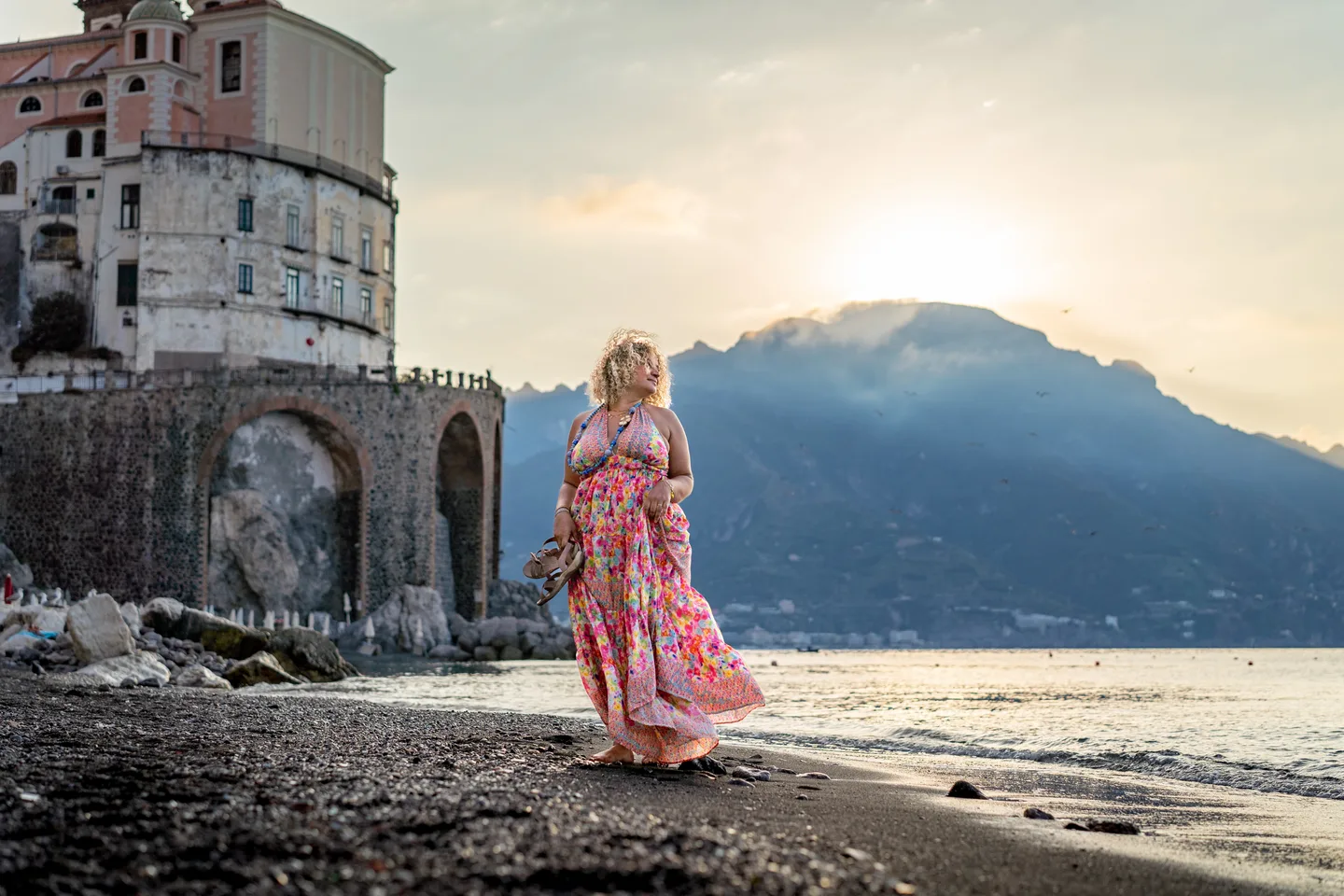 Hinad on the beach beside the old stone tower