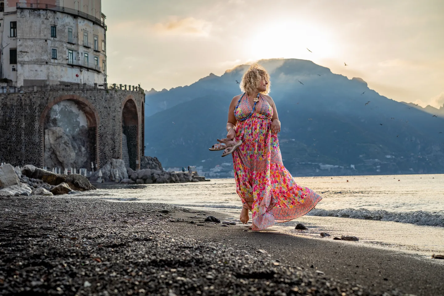 Sunrise behind Hinad and the mountains at the shore