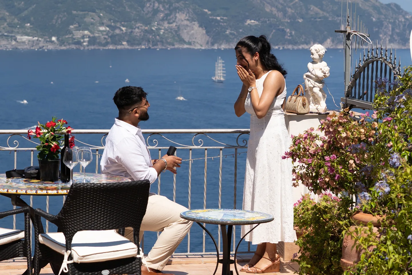 Jassi holding the ring as his partner covers her face