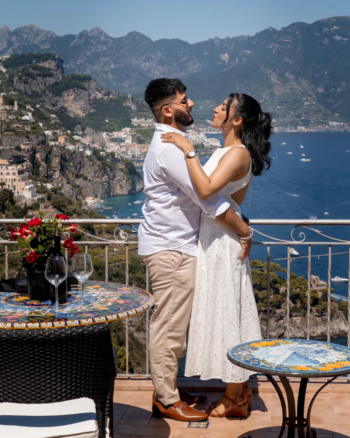 The couple kissing on the sea-view terrace