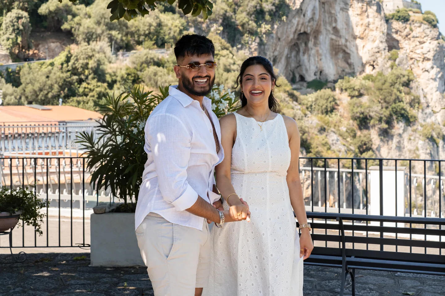 A portrait together beside the hillside railing