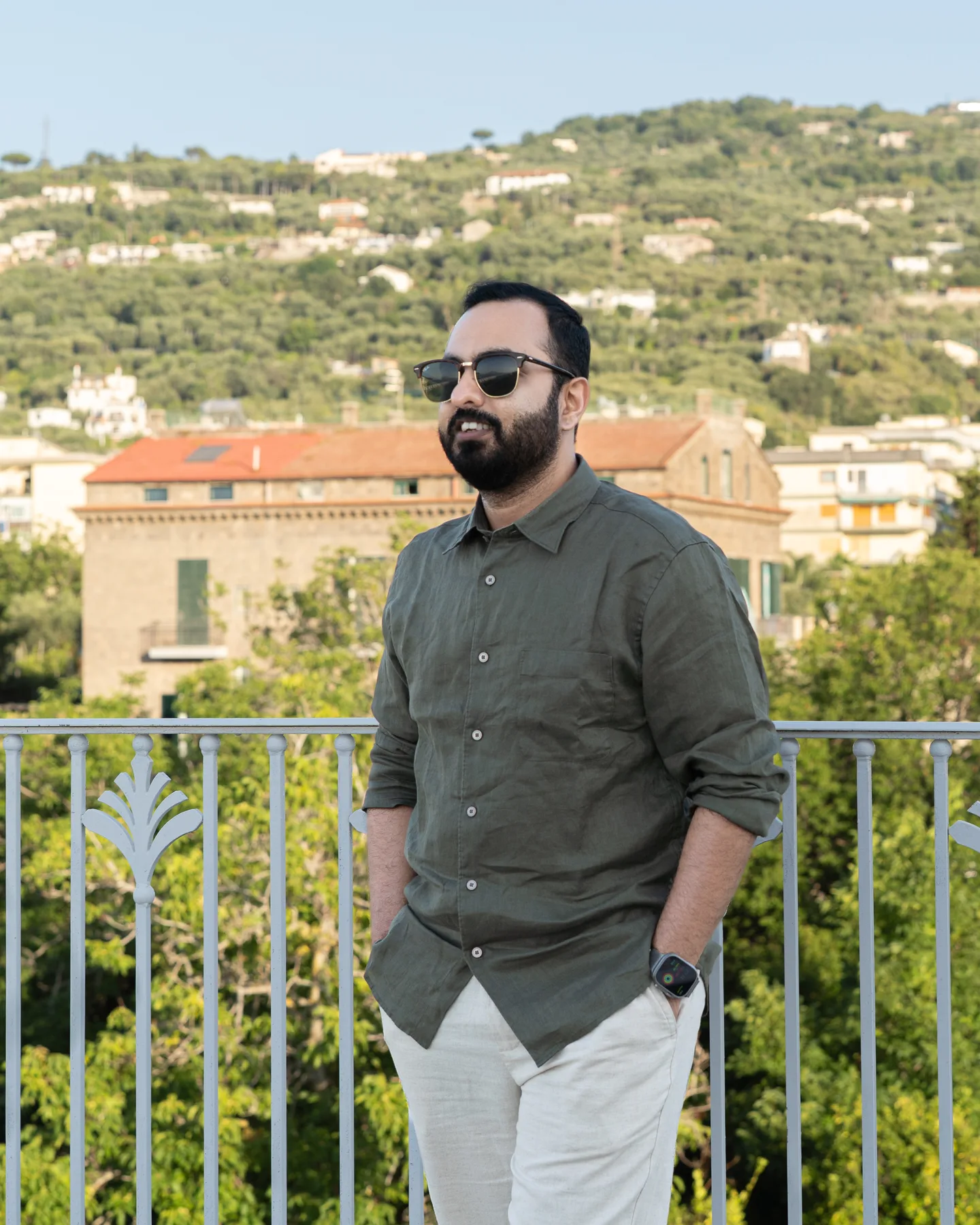 Jatin in a green shirt above the rooftops