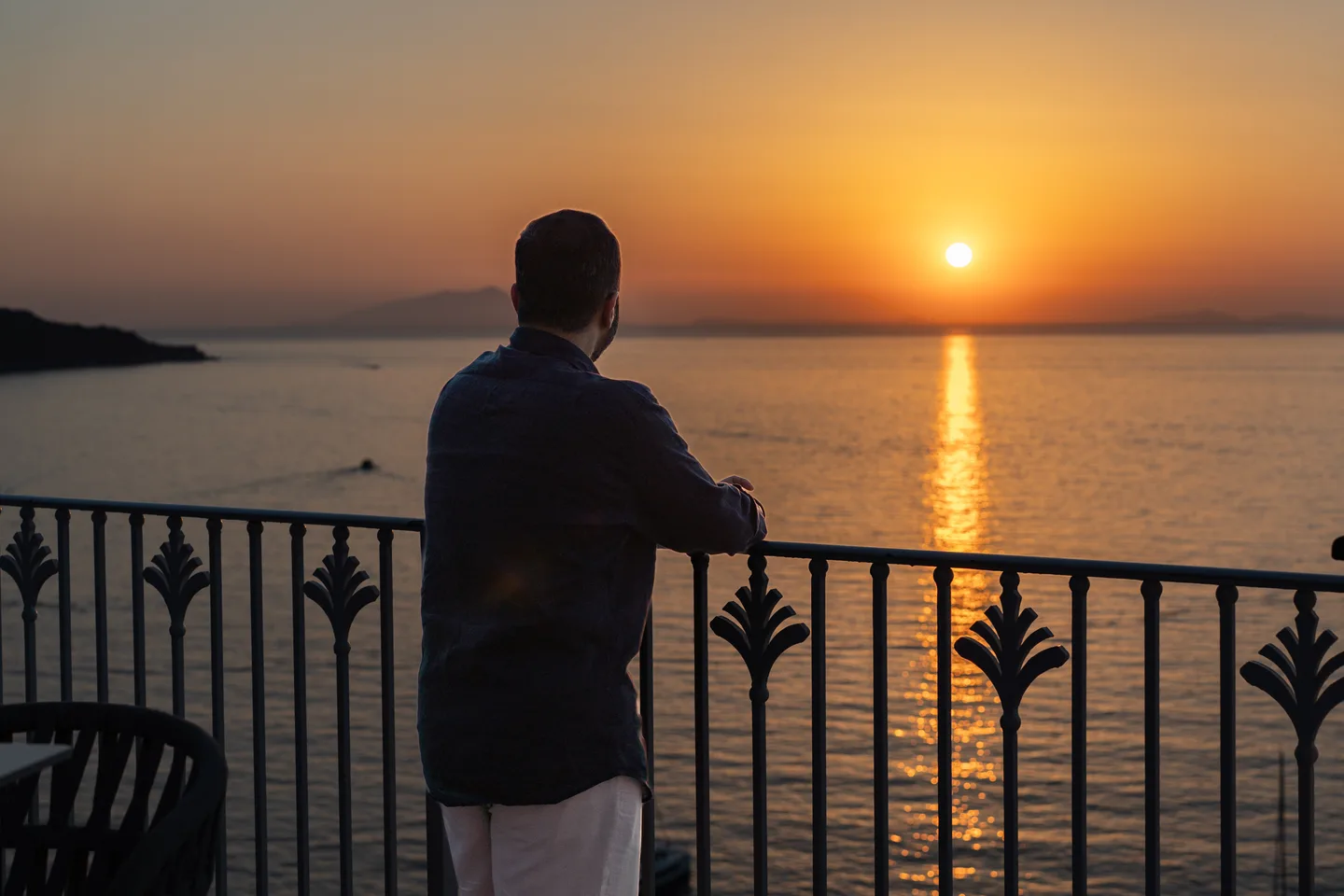 Jatin watching the sun set over the sea