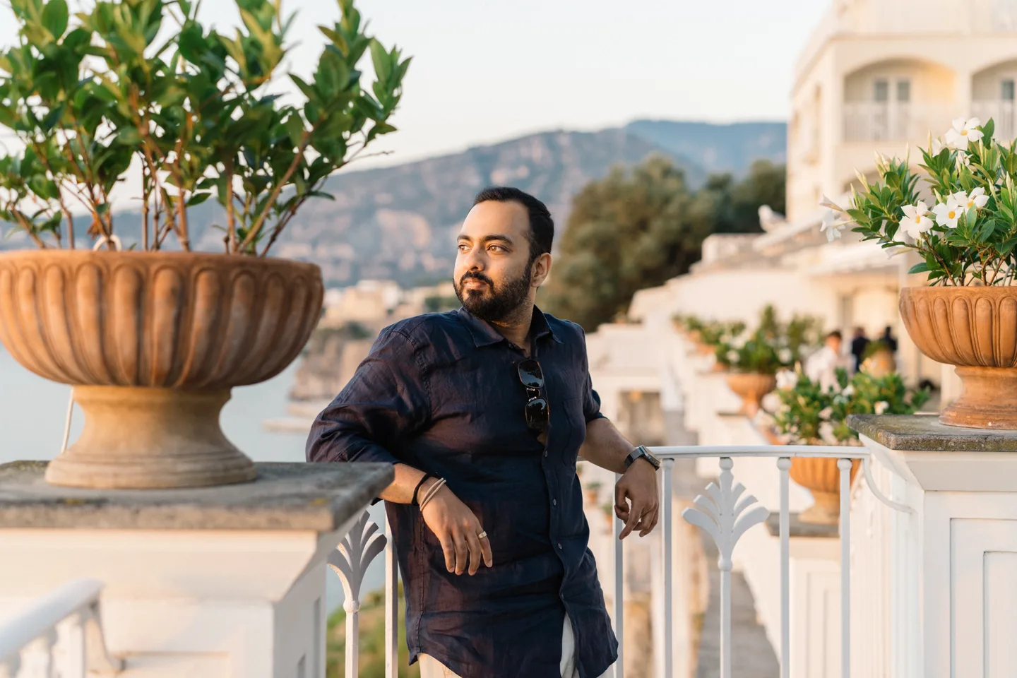 Jatin resting beside a planter on the terrace
