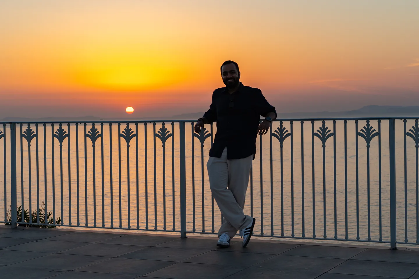 Jatin silhouetted against the orange sunset