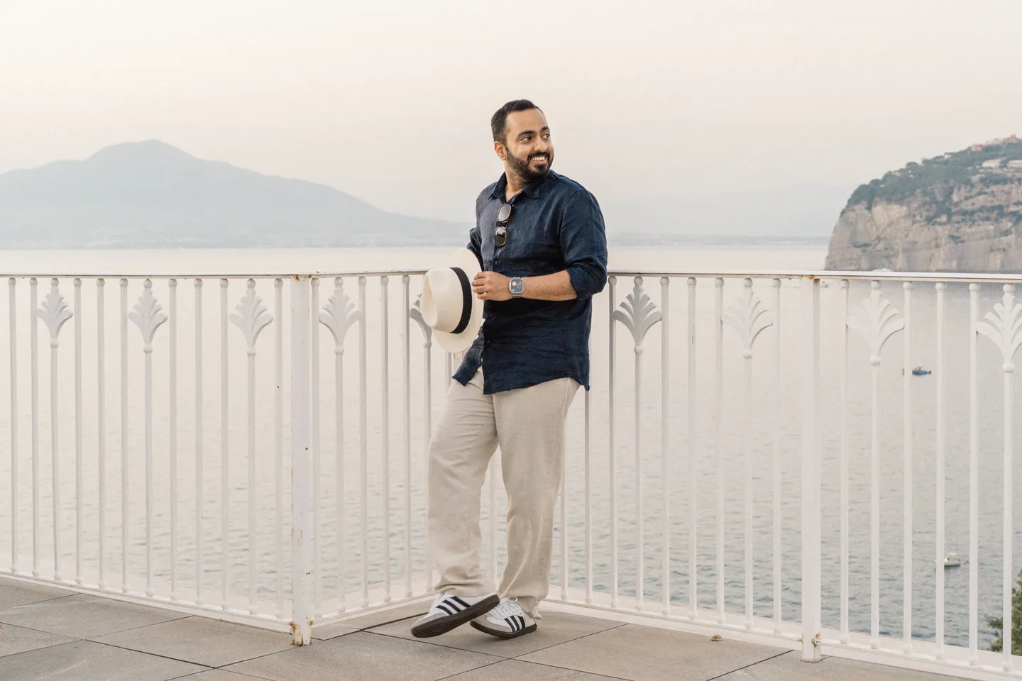 A wide portrait of Jatin above the sea and Sorrento