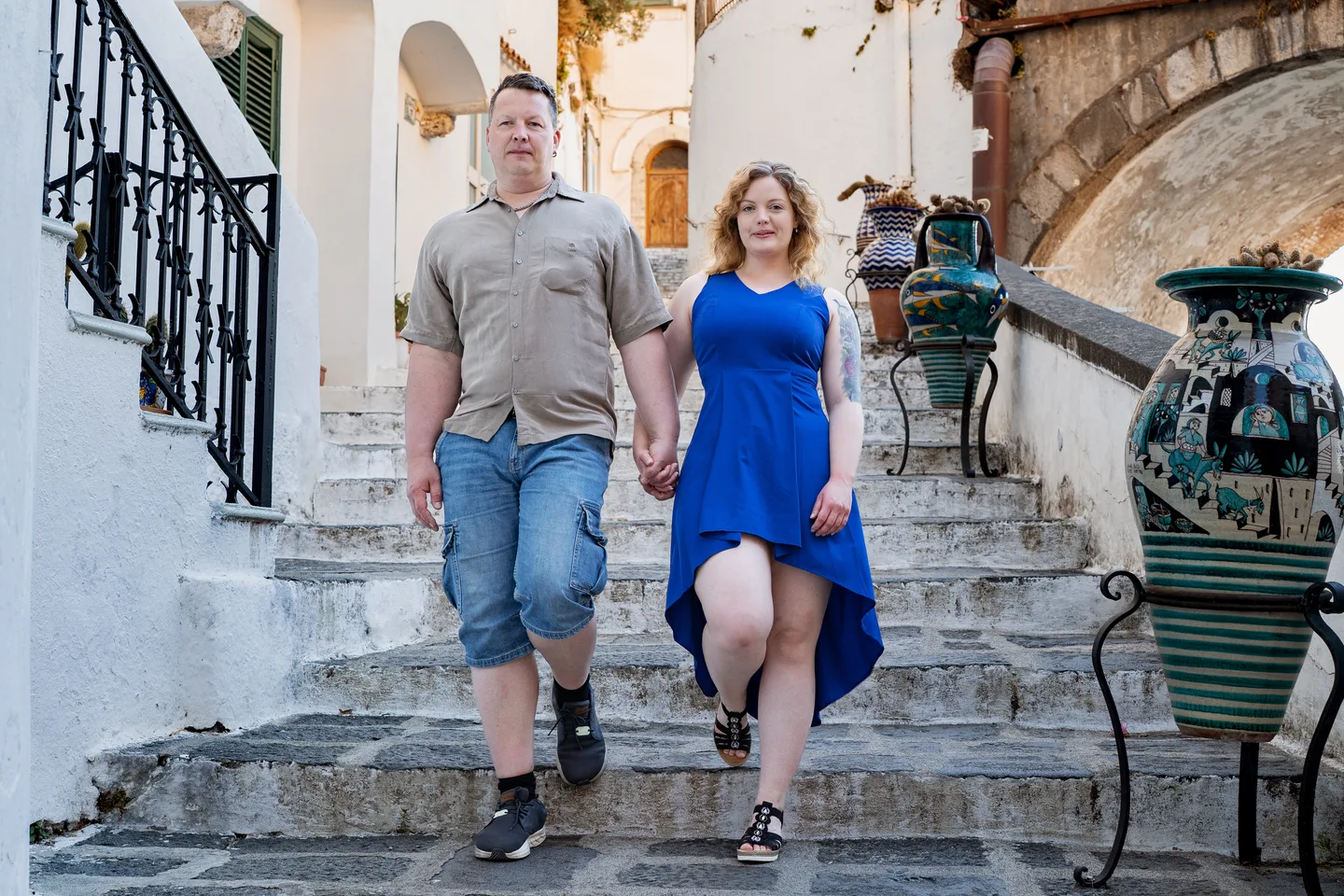 The couple descending a flight of village steps