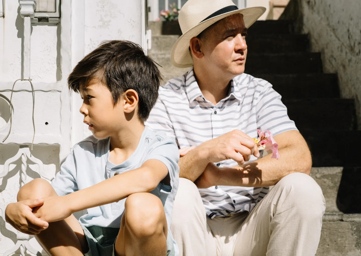 Father and son looking along the village street