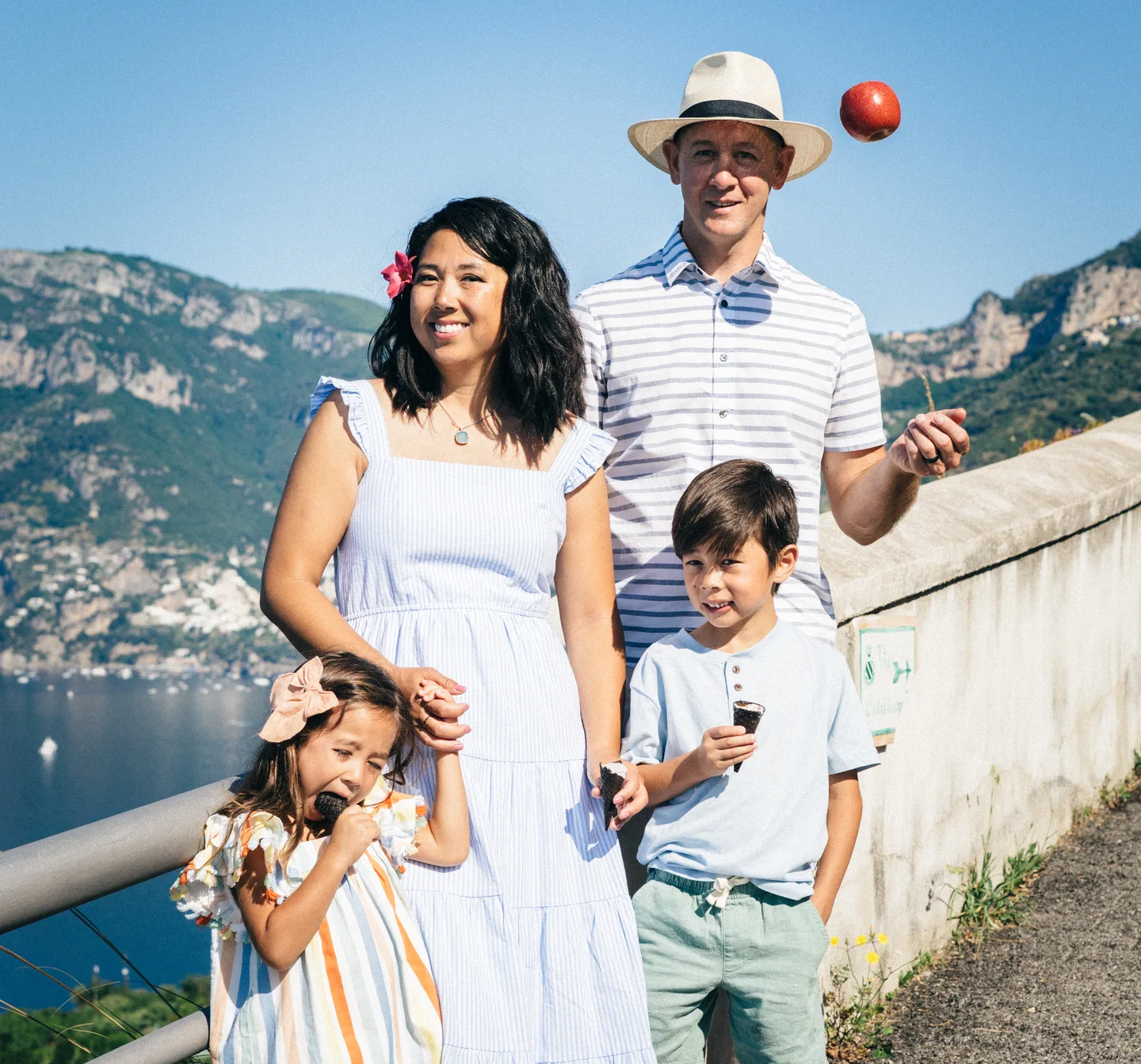 Nick tossing an apple beside his family