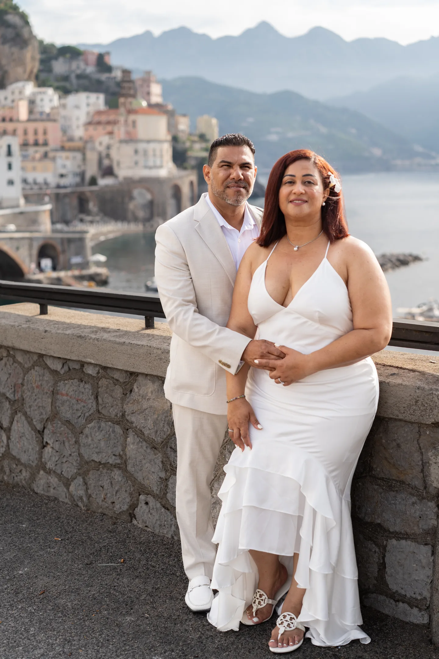 A full-length portrait of the couple at the Atrani overlook