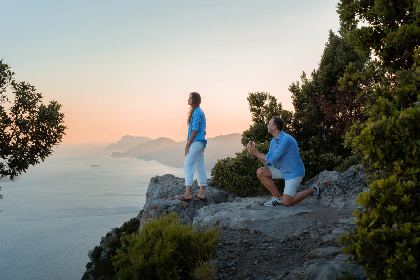 The couple on the rocks in soft evening light