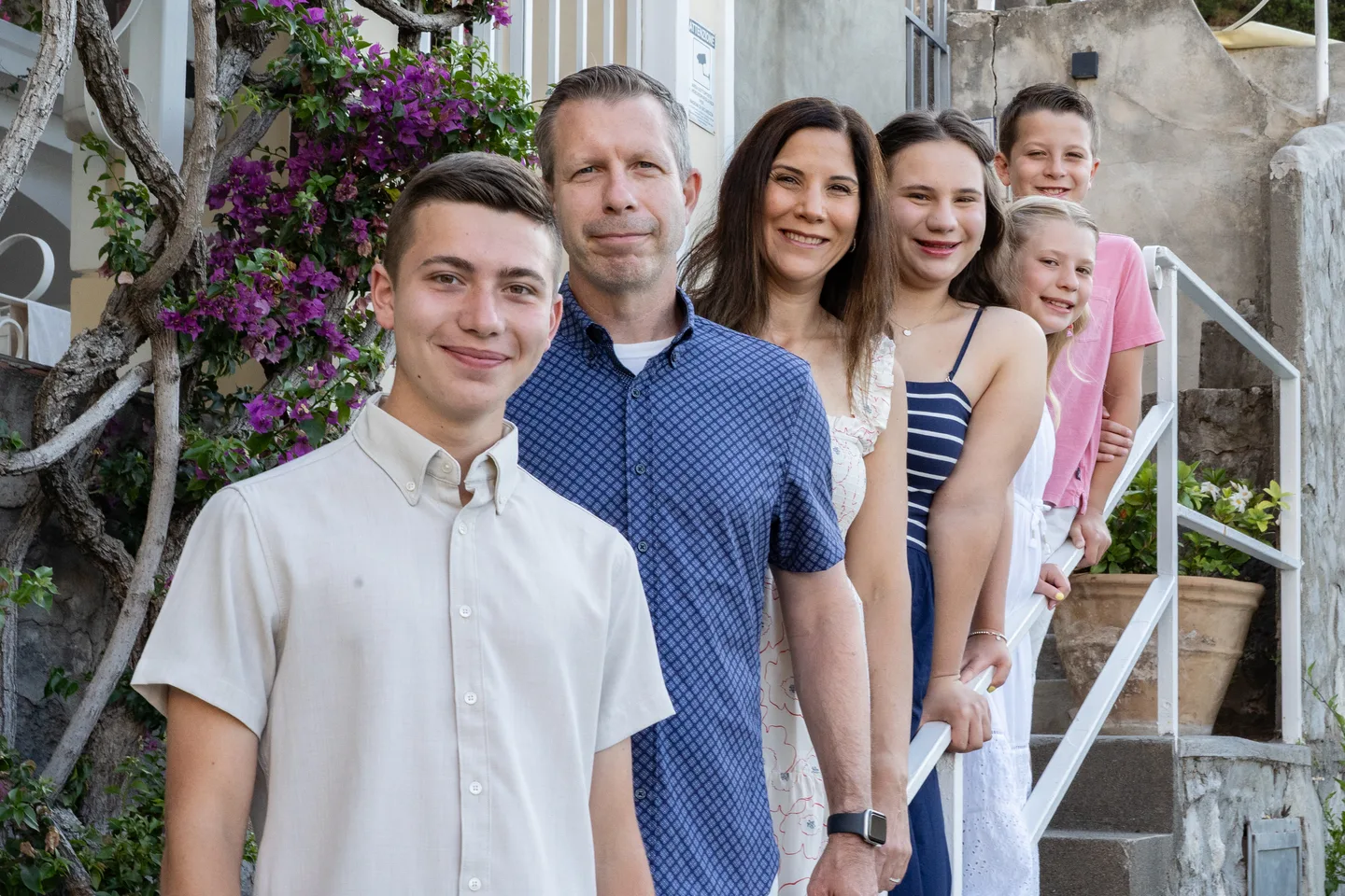 The family lined up on the beach steps