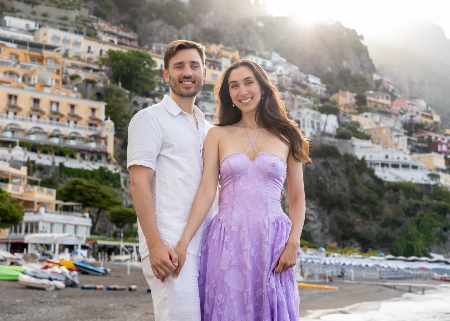 The couple smiling at the end of the beach walk