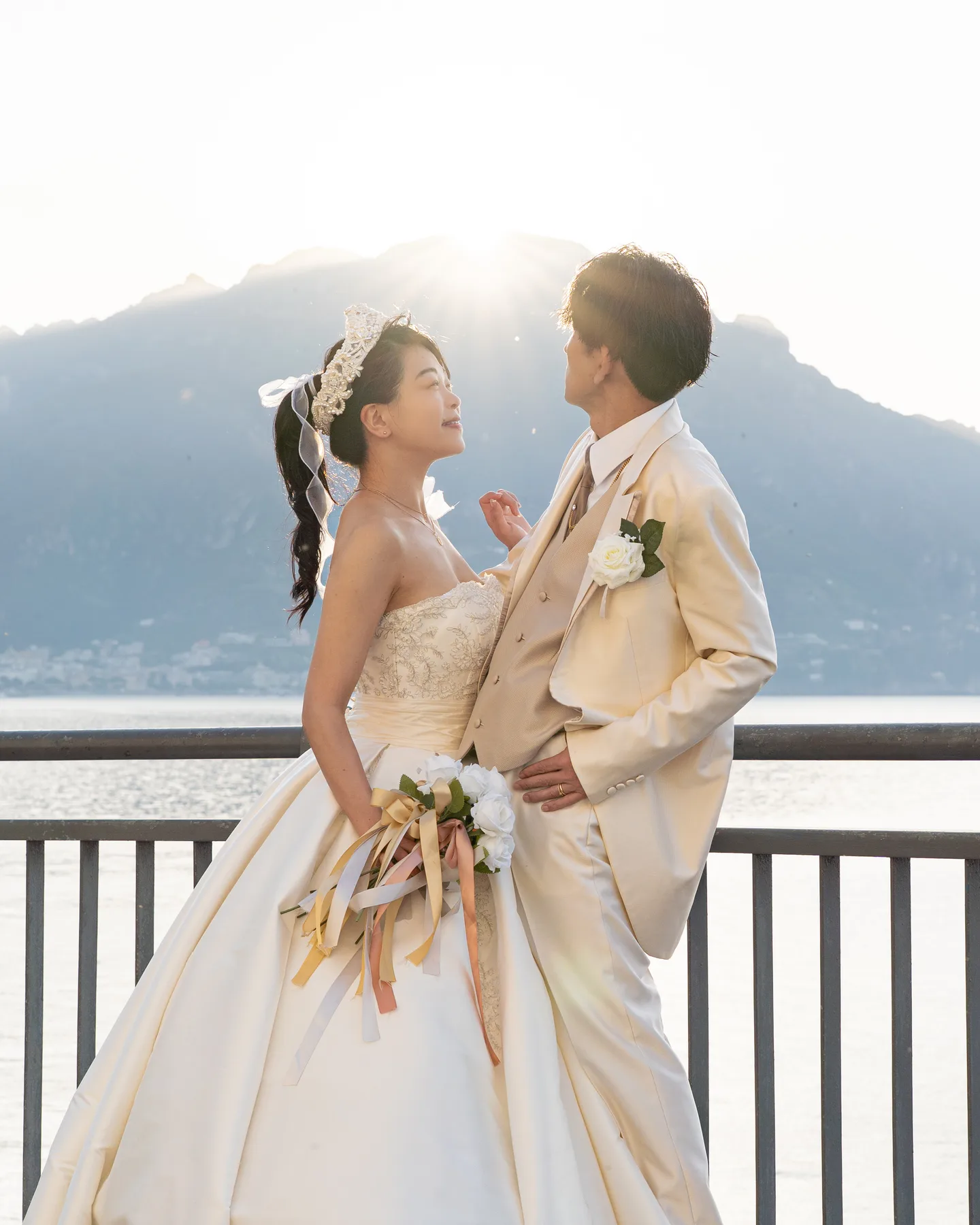 The couple looking at one another in the first sunlight