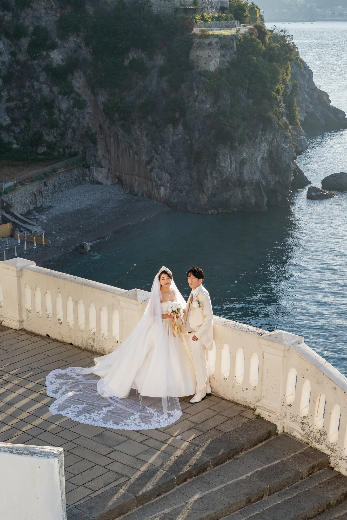 A wide view of the wedding dress on the seaside terrace