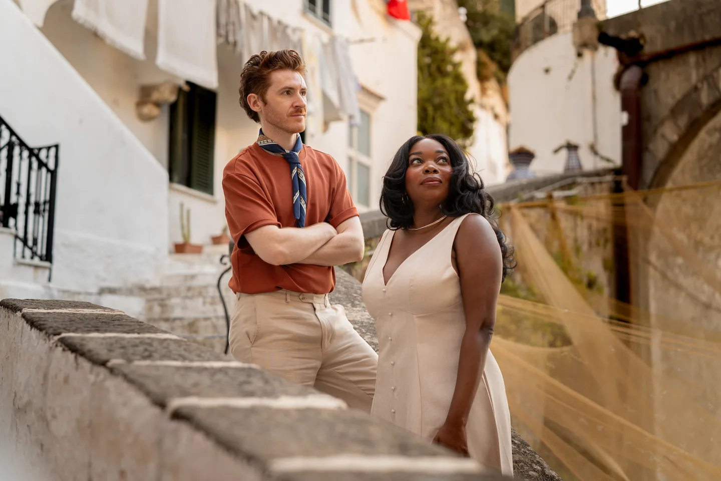 A portrait of the couple on the curving stone stairs