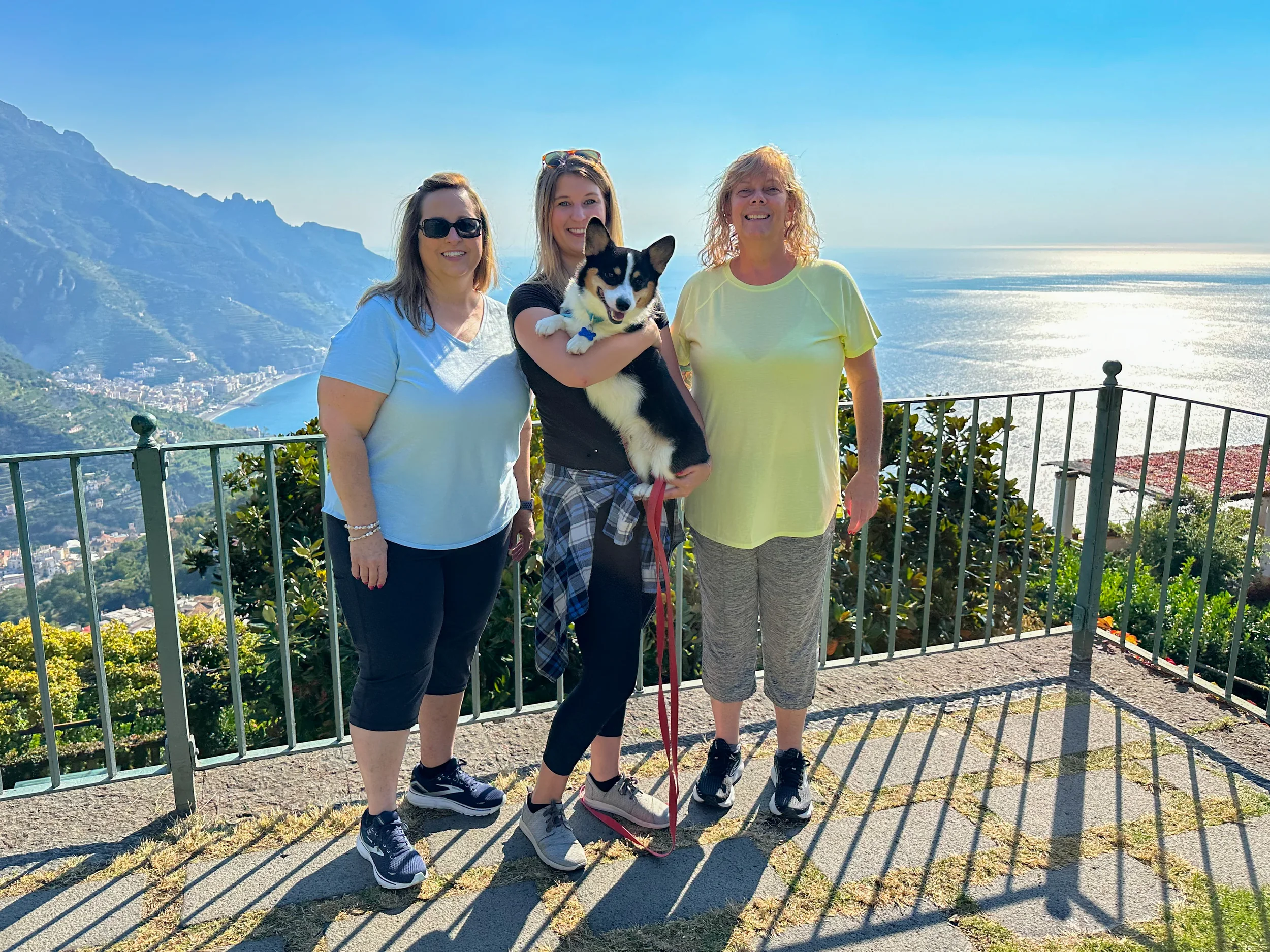 Guests at a mountain viewpoint overlooking the Amalfi Coast