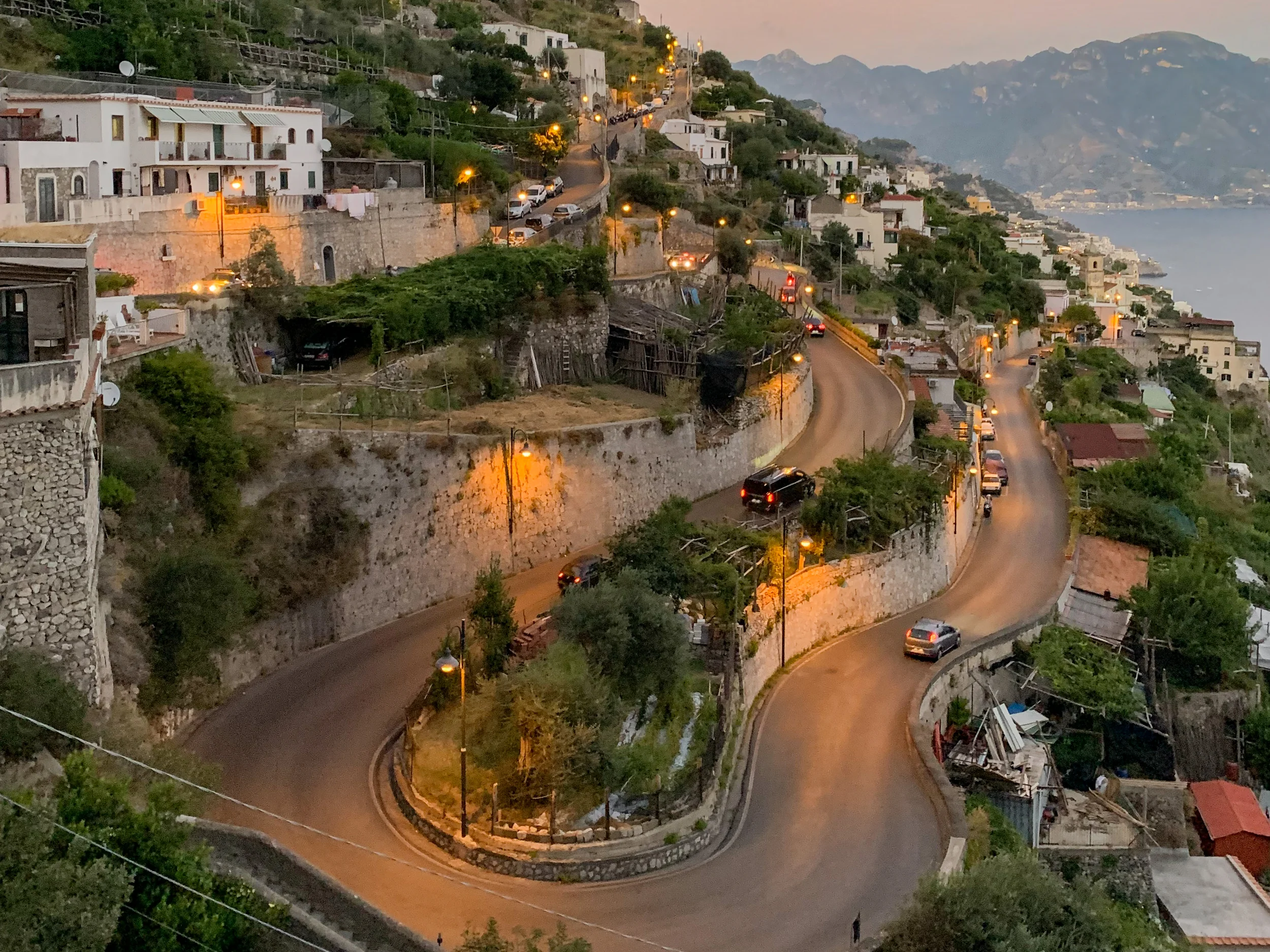 Rider on a scooter with coast panorama behind